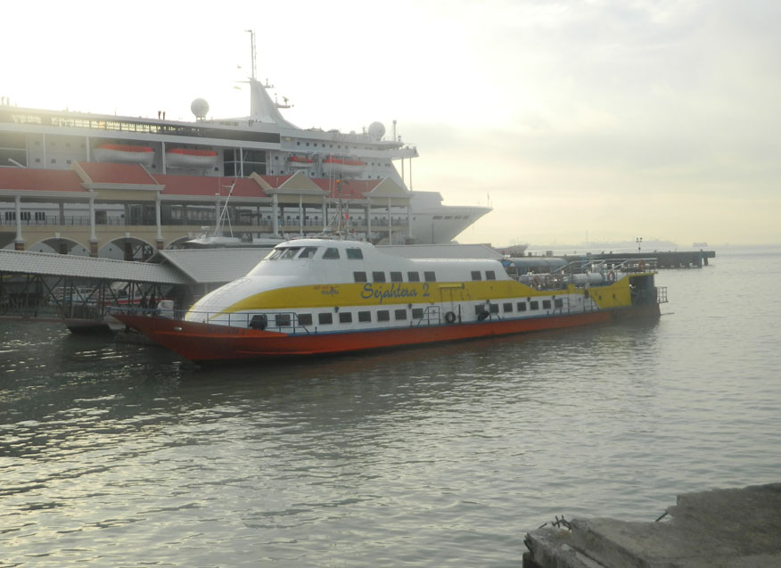 Langkawi speedboat set against a cruise liner