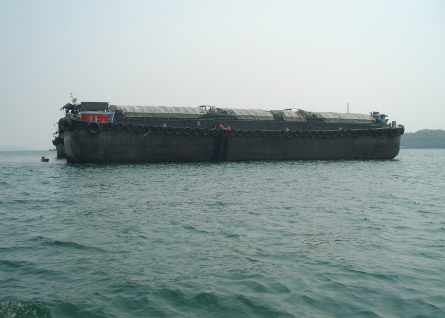 one of the numerous barges for tranferring cargo to the mainland