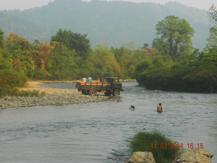 Russian truck fording Song River near Vang Vieng